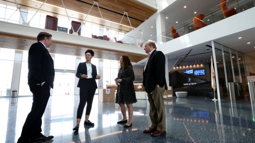 Intern speaking to American Water team in lobby