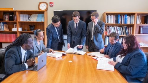  Group of attorneys working around table in conference room