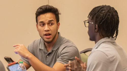 Two male Rutgers Law students engage in discussion.