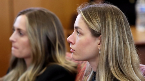 two women looking toward the left