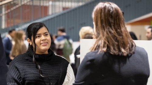 woman listening to another woman