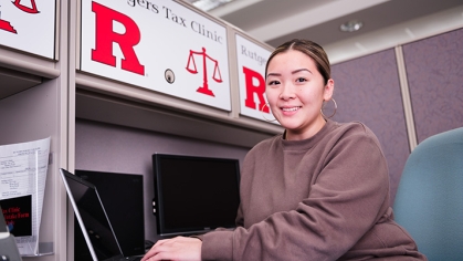 Woman working at laptop at desk