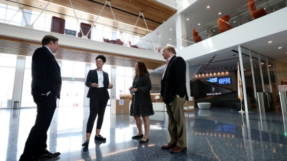 two women and two men in lobby of American Water
