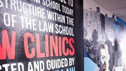 colorful mural in hallway with images and text 