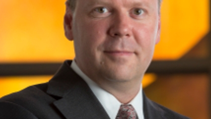 man in a suit posing for a photograph