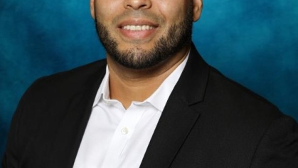 man in a suit posing for a photograph