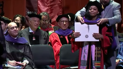 girl being hooded at a law school graduation ceremony