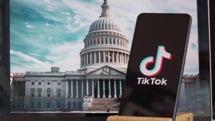 photograph of a phone in front of a government building