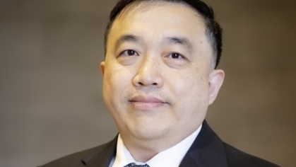 man in suit grinning