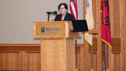 woman speaking into a microphone