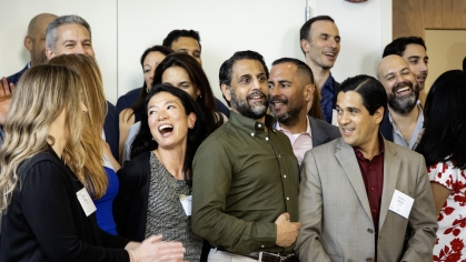 Group of law school alumni smiling and laughing