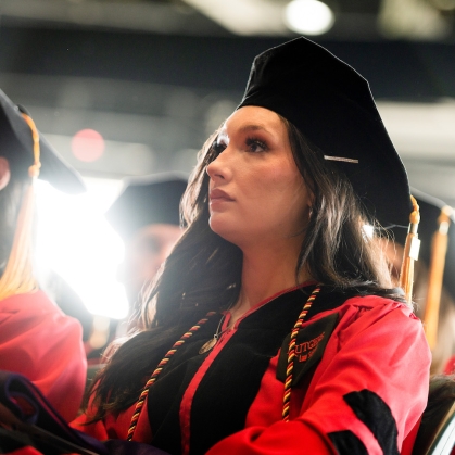 Student in cap and gown at Camden Commencement