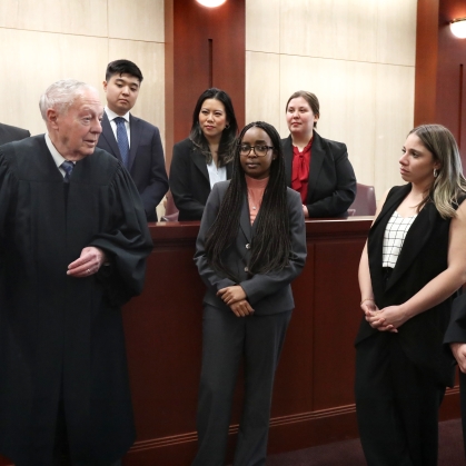 Law students listening to judge  