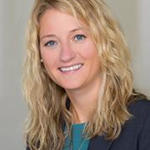A blonde woman smiling