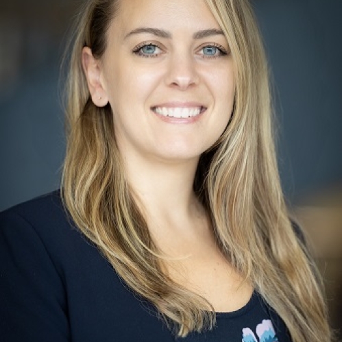 A blonde woman smiling