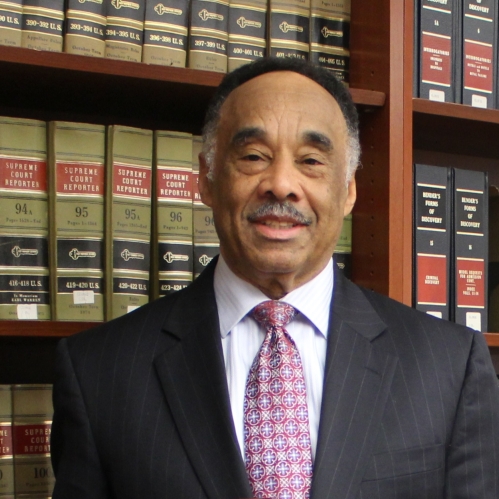 a man with a mustache smiling