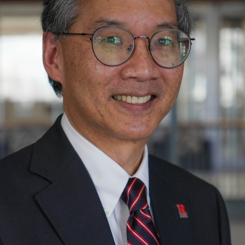 man with glasses smiling