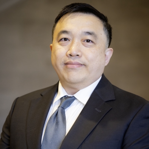 man in suit grinning