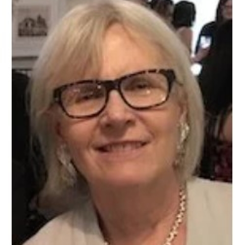 Woman smiling wearing black glasses