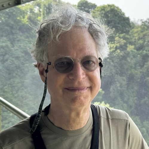 Photo of Richard Hyland, background mountains