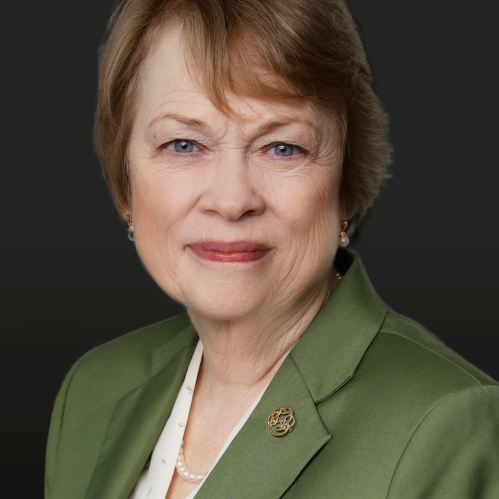 Portrait of woman in a green blazer