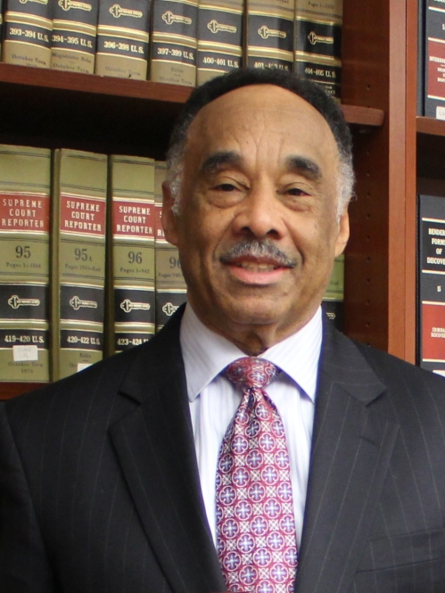 a man with a mustache smiling