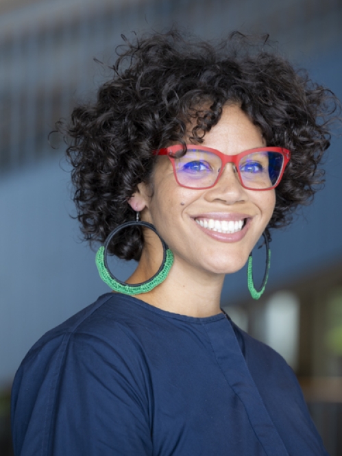 woman in glasses smiling