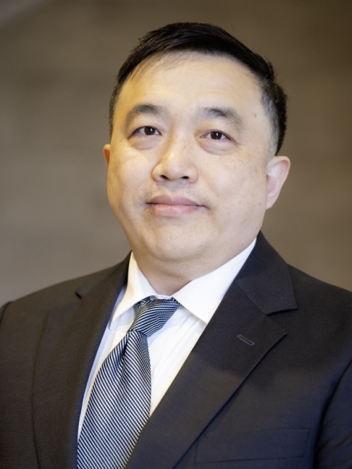 man in suit grinning