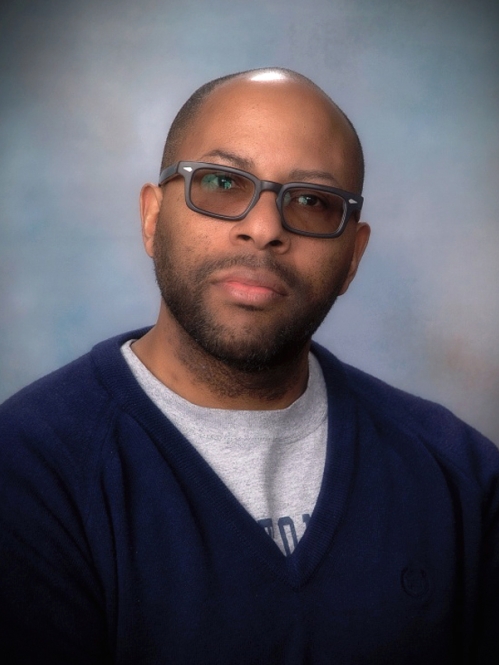 Man with glasses wearing sweater turtleneck 