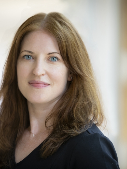 Woman grinning wearing black shirt