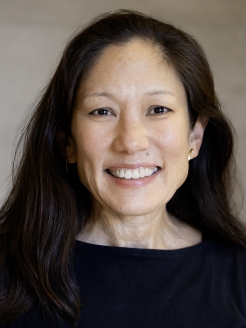 woman in black shirt smiling
