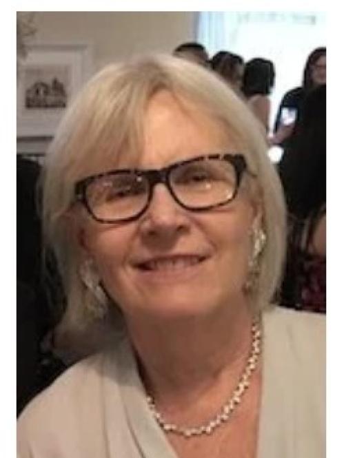 Woman smiling wearing black glasses
