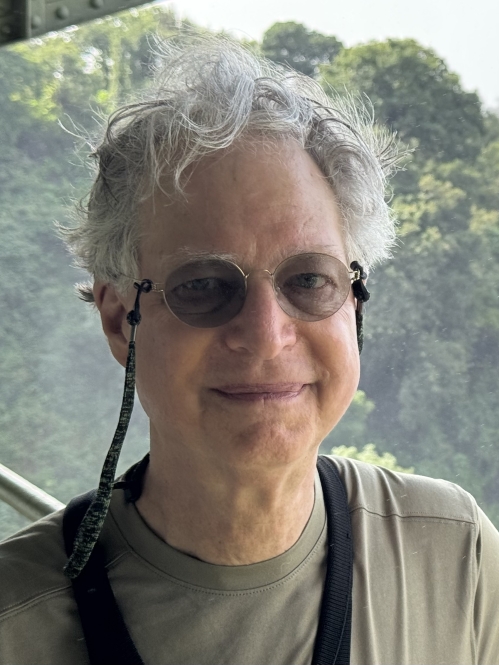 Photo of Richard Hyland, background mountains