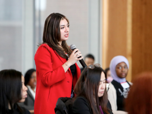 Student presenting into a microphone