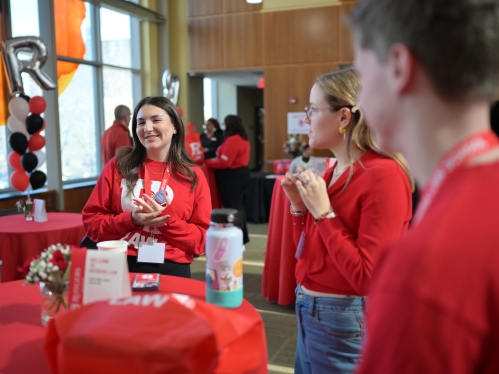 people in red around red table 