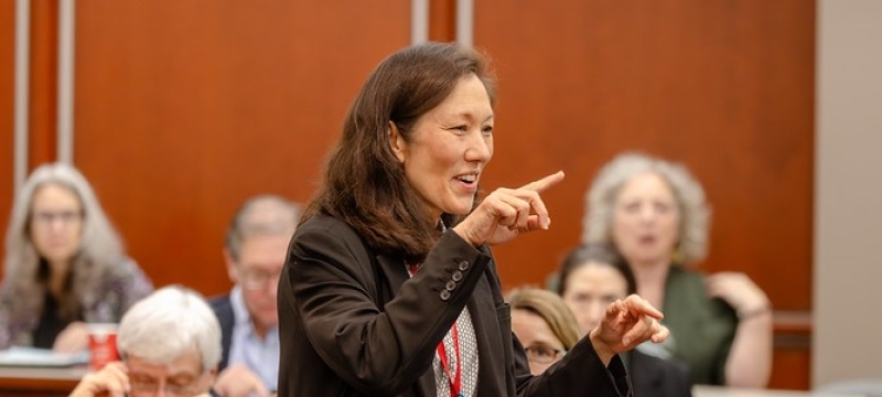 woman pointing in front of audience in mock courtroom