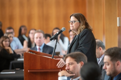 woman speaking at podium
