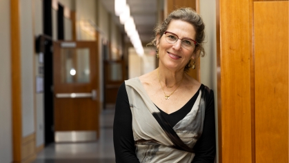 woman posing for a photograph in a hallway