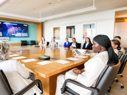 group of people sitting around a table