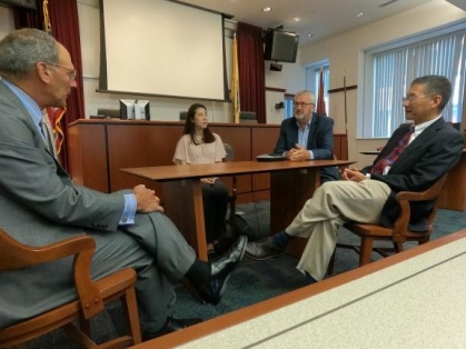 Group of people in a discussion around a table