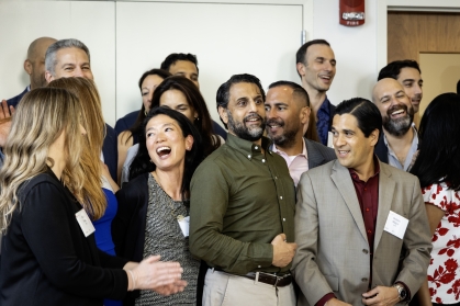 Group of law school alumni smiling and laughing