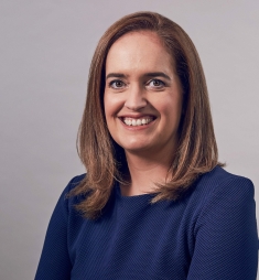 woman in blue smiling