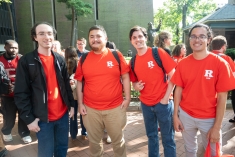 four men in red R Law tshirts standing and smiling outside