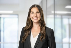 woman in a suit posing for a photograph
