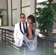 man and woman posing for a photograph