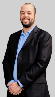 man in a suit posing for a photograph