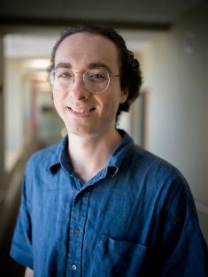 man in blue shirt smiling