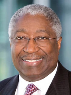 man in a suit posing for a photograph