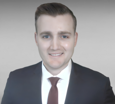 man in a suit posing for a photograph