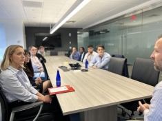 group of people sitting around a table
